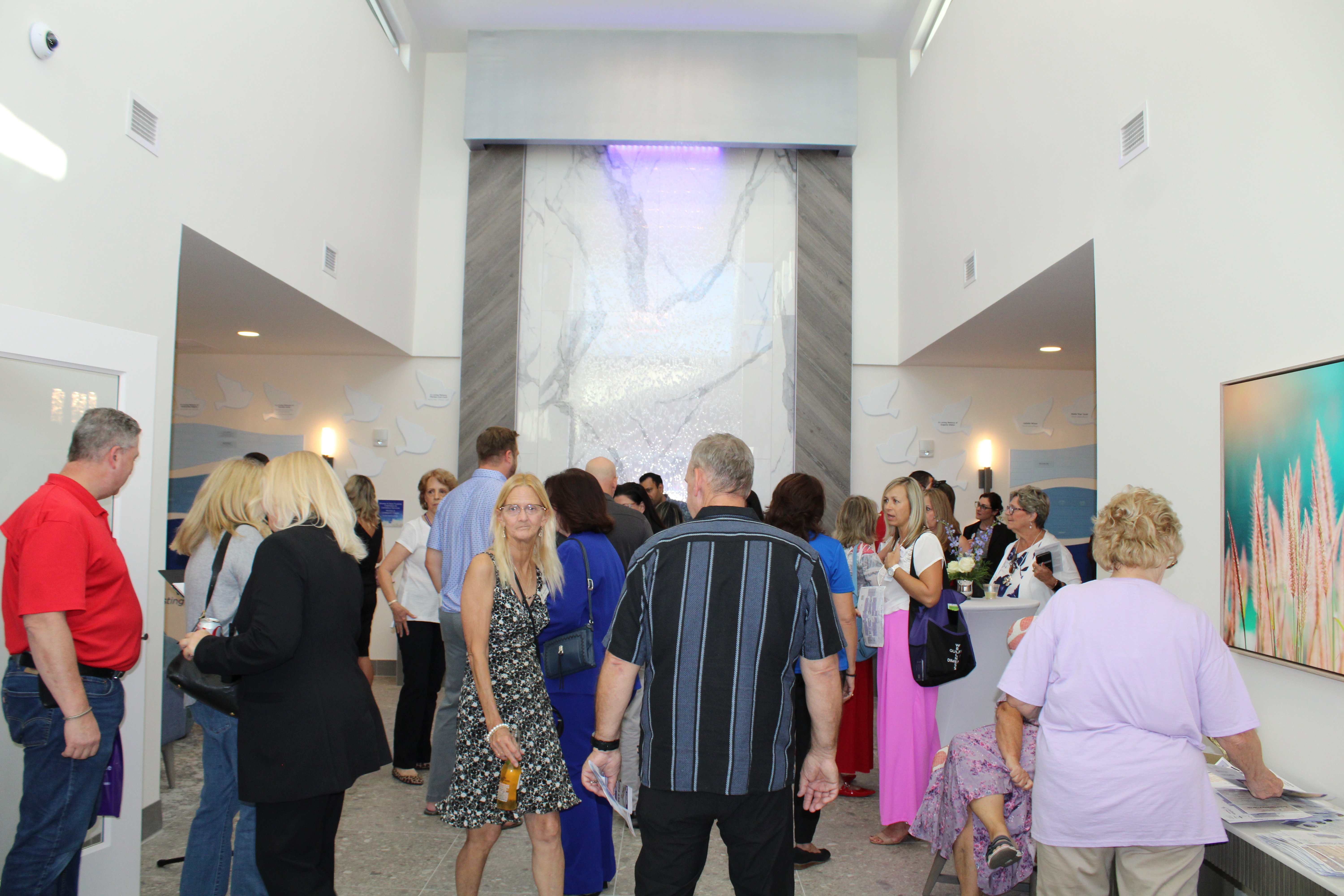 Guests arrive in the entry for the grand opening event