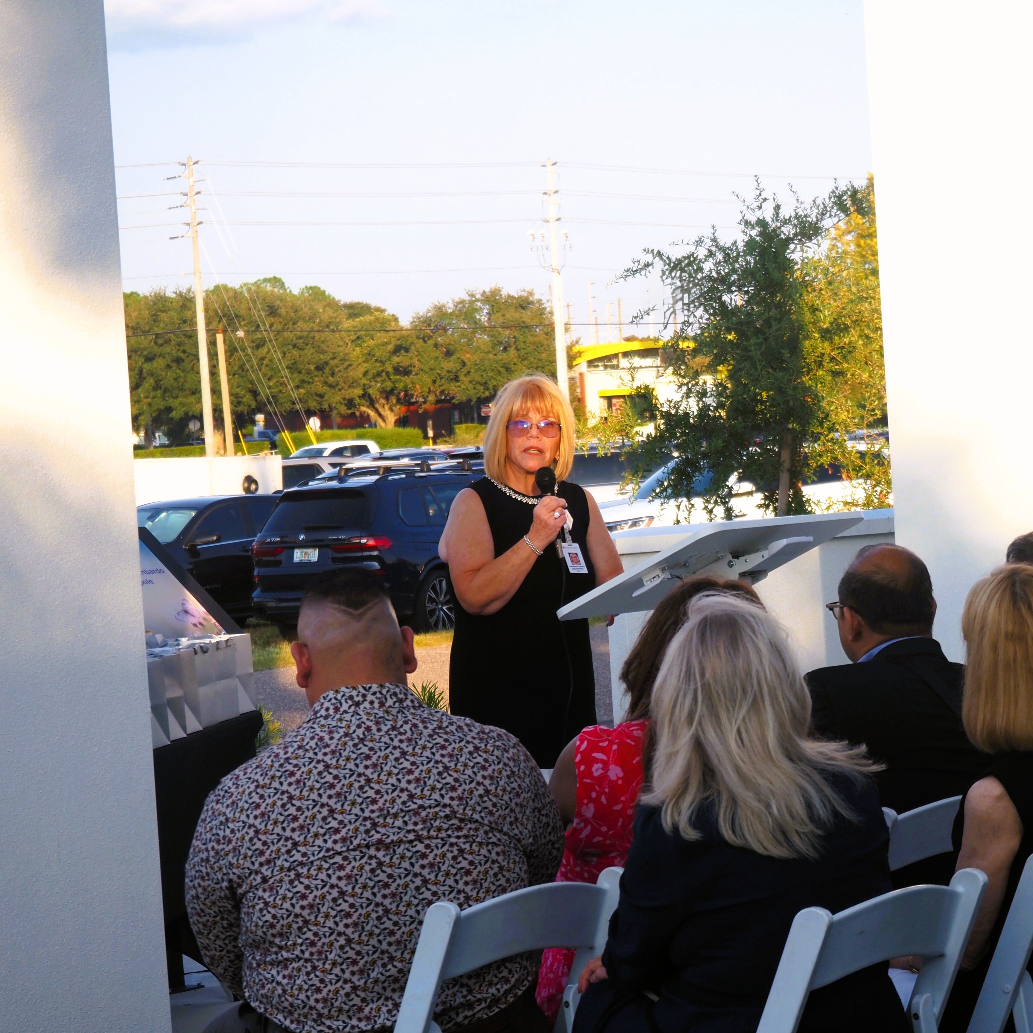 Chief Operations and Business Innovations Officer Kathleen Postiglione speaks during the grand opening